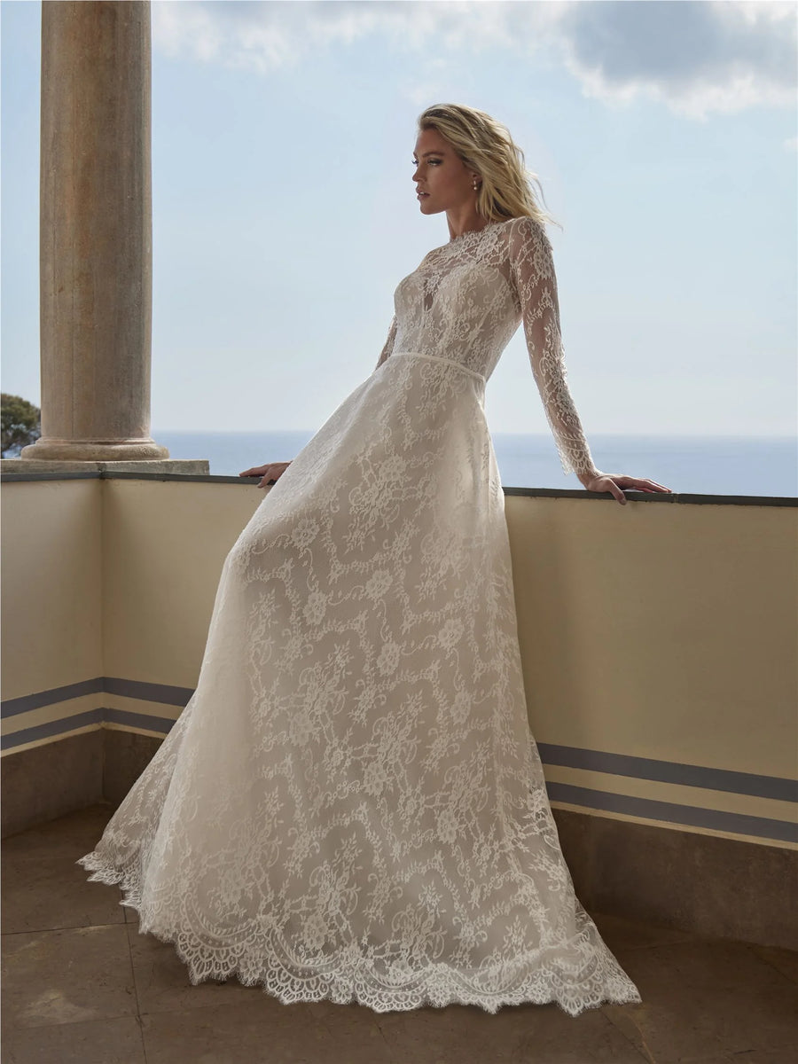 Pronovias Ati A-line lace wedding dress with bateau neckline and long sleeves, front view