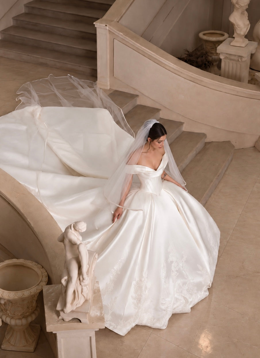 Luxury ballgown wedding dress with off shoulder straps and basque waist mikado fabric with lace on skirt