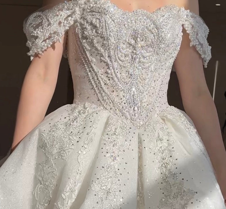Luxury princess ball gown with basque waist and corset back and off shoulder beaded lace straps
