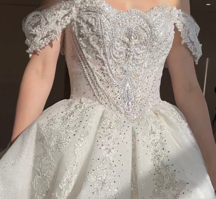 Luxury princess ball gown with basque waist and corset back and off shoulder beaded lace straps