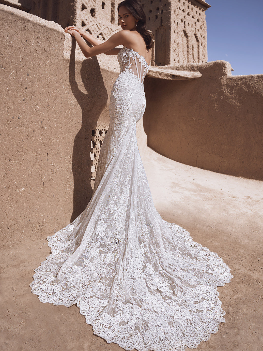 Blue by Enzoani lace fitted wedding dress with structured bodice and beads train view