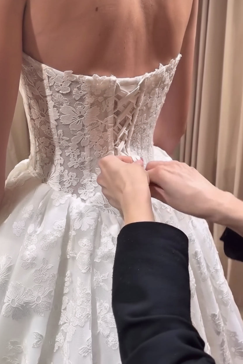 Bride shopping with a bridal consultant at Camellia Wedding Gown during a personalized wedding dress appointment in Toronto.