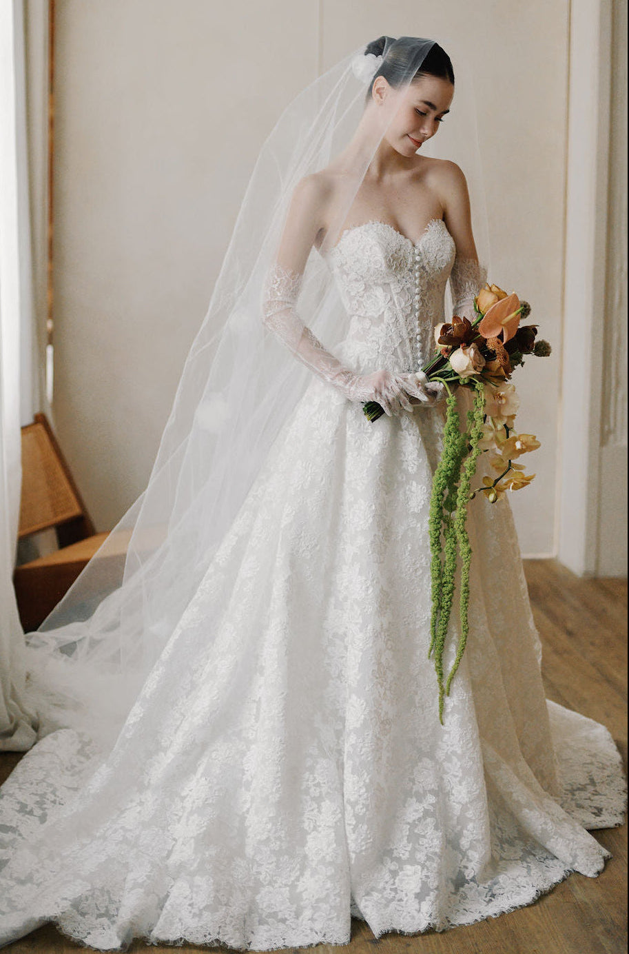 Bride wearing a designer wedding dress at Camellia Wedding Gown, a luxury bridal boutique in Toronto.