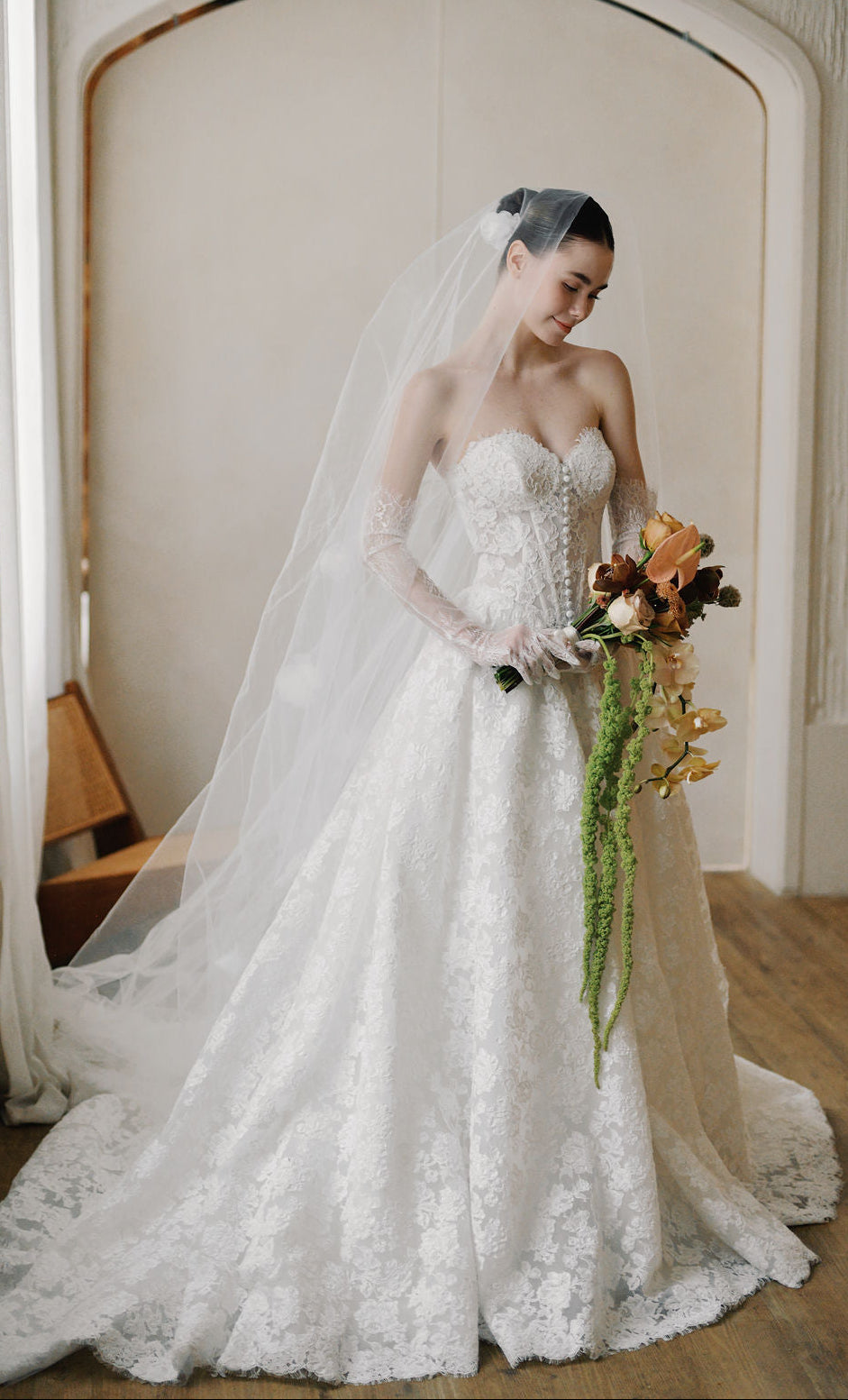 Bride wearing a designer wedding dress at Camellia Wedding Gown, a luxury bridal boutique in Toronto.