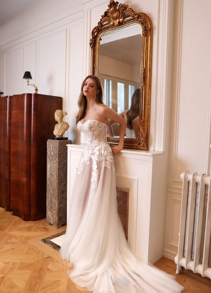 Choie Iridelle sample sale aline wedding dress with floral appliqués front view