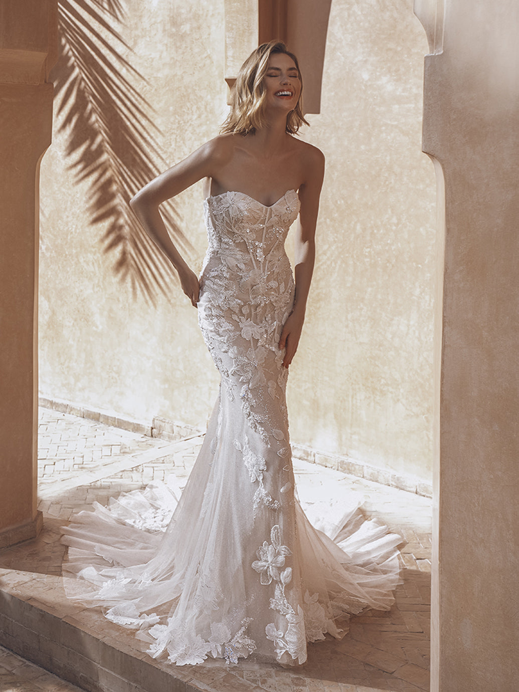 Enzoani Ursa sample sale fitted strapless wedding dress with sparkly floral appliqué front view