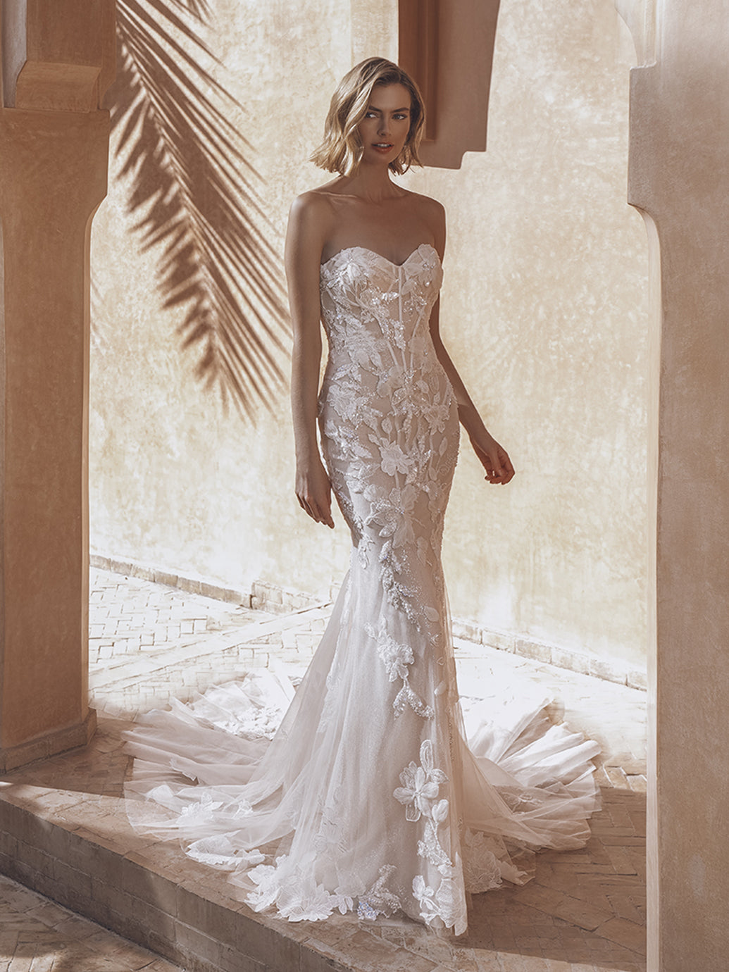 Enzoani Ursa sample sale fitted strapless wedding dress with sparkly floral appliqué  side view