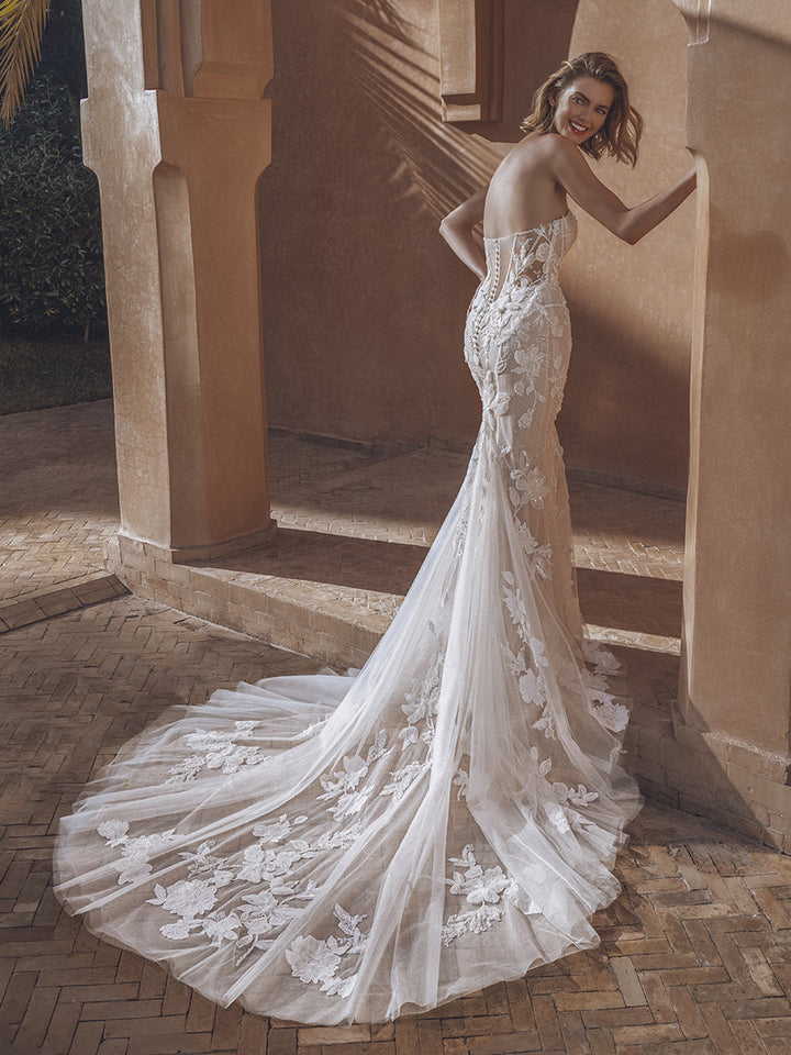 Enzoani Ursa sample sale fitted strapless wedding dress with sparkly floral appliqué  train view