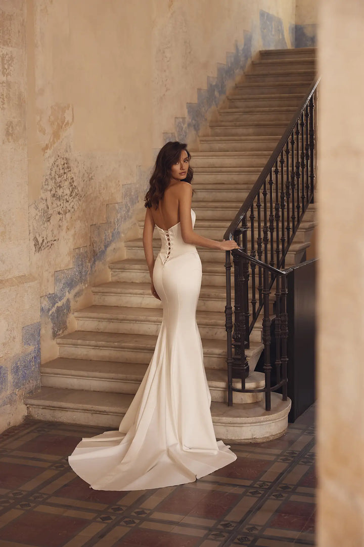 Pnina Tornai 15082 strapless fit-and-flare wedding dress with corset bodice and lace up back view