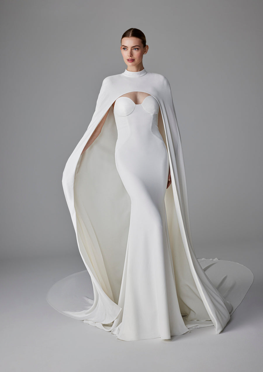 Pronovias Alexandrine fitted strapless wedding dress with structured bodice and cape front view