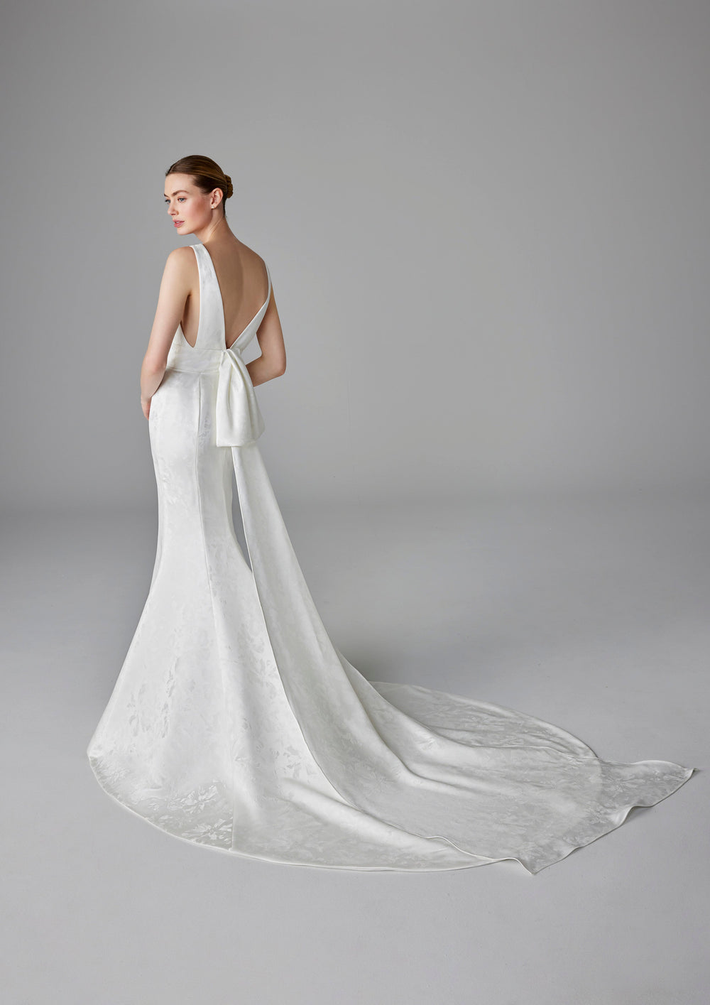Pronovias Charline fitted wedding dress with v-neckline and low back train view