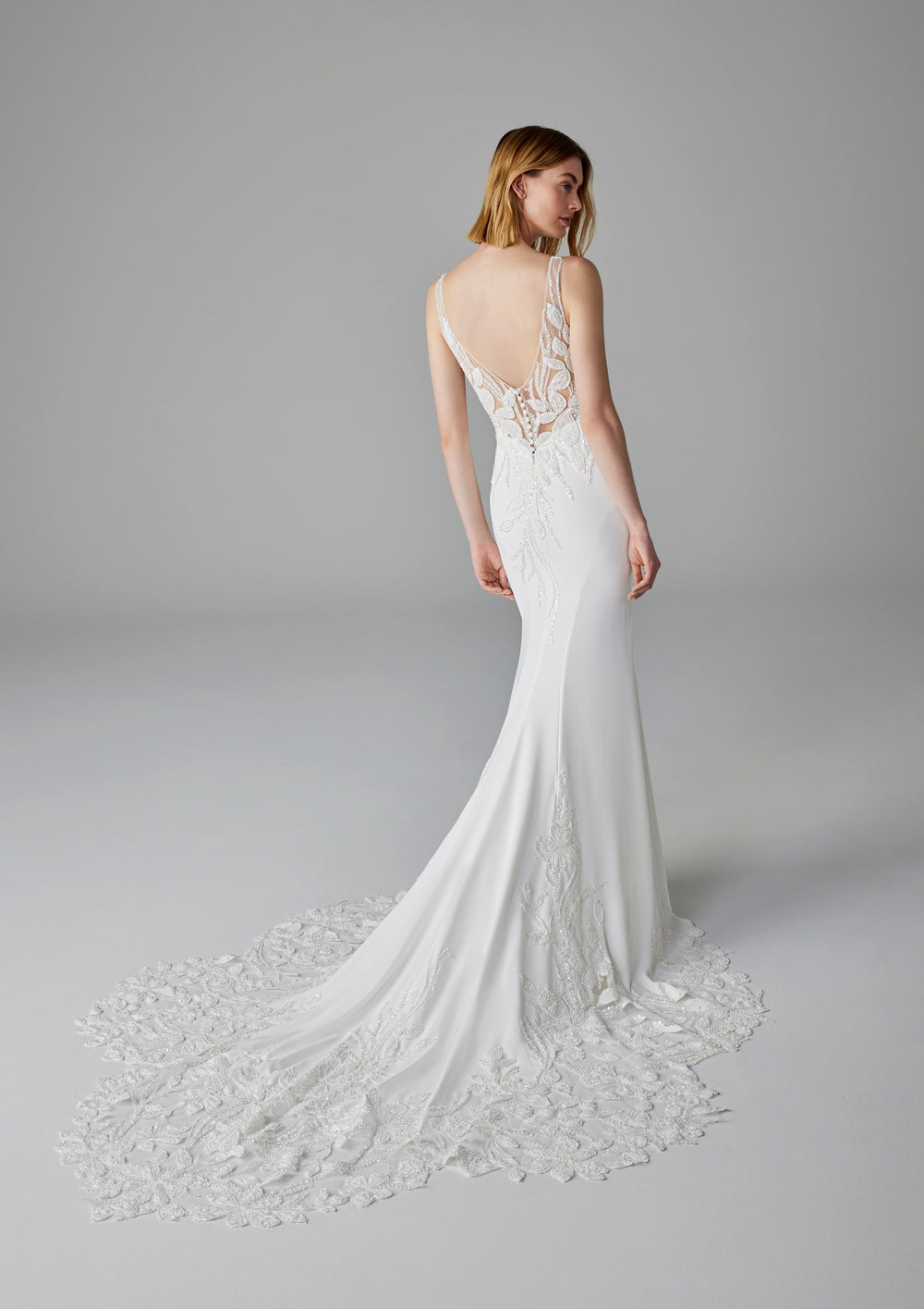 Pronovias Debby fitted wedding dress v-neckline floral sparkly appliqué low back view