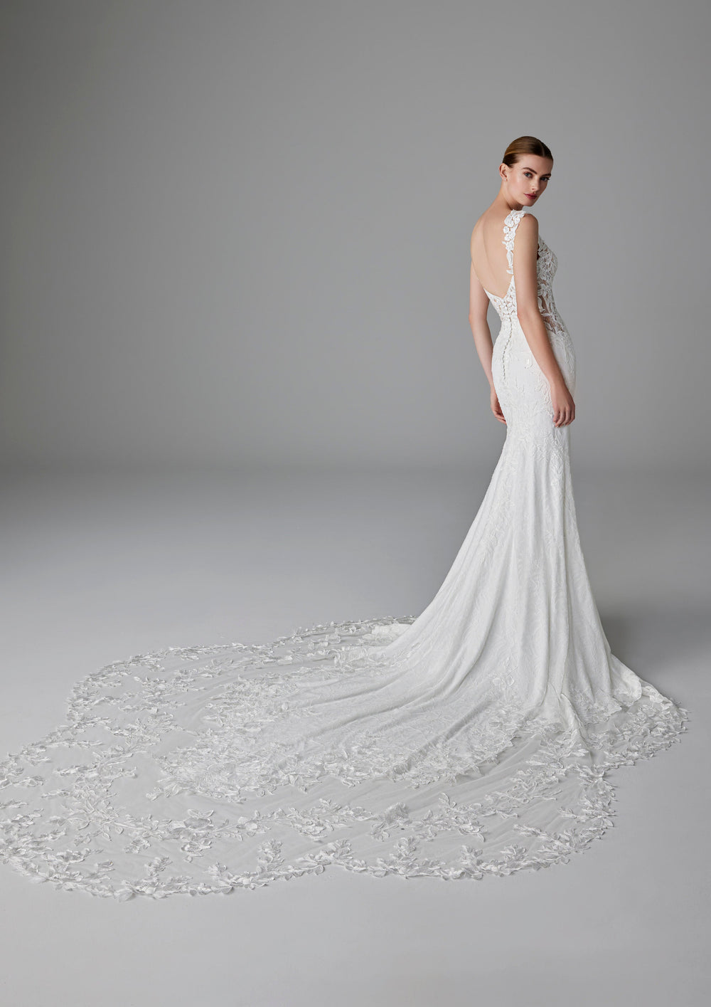 Pronovias Dion fitted wedding dress with floral appliqué back view
