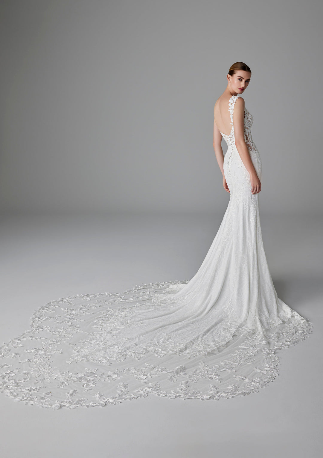 Pronovias Dion fitted wedding dress with floral appliqué back view