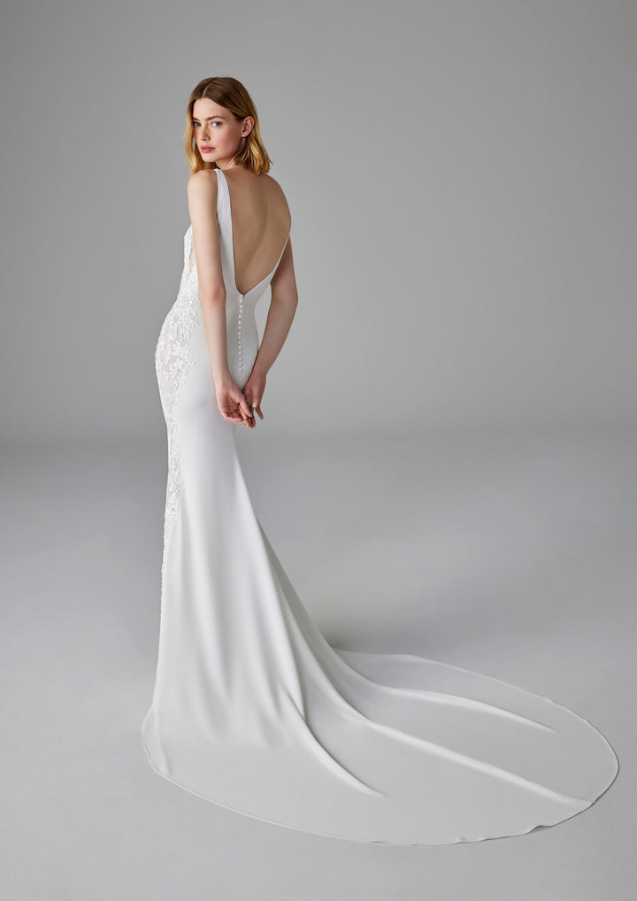 Pronovias Elea fitted crepe wedding dress v-neck low back train view