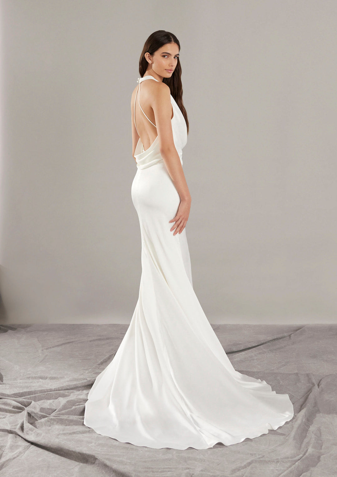 Pronovias Gabriell fitted satin wedding dress with halter neckline and low back side view