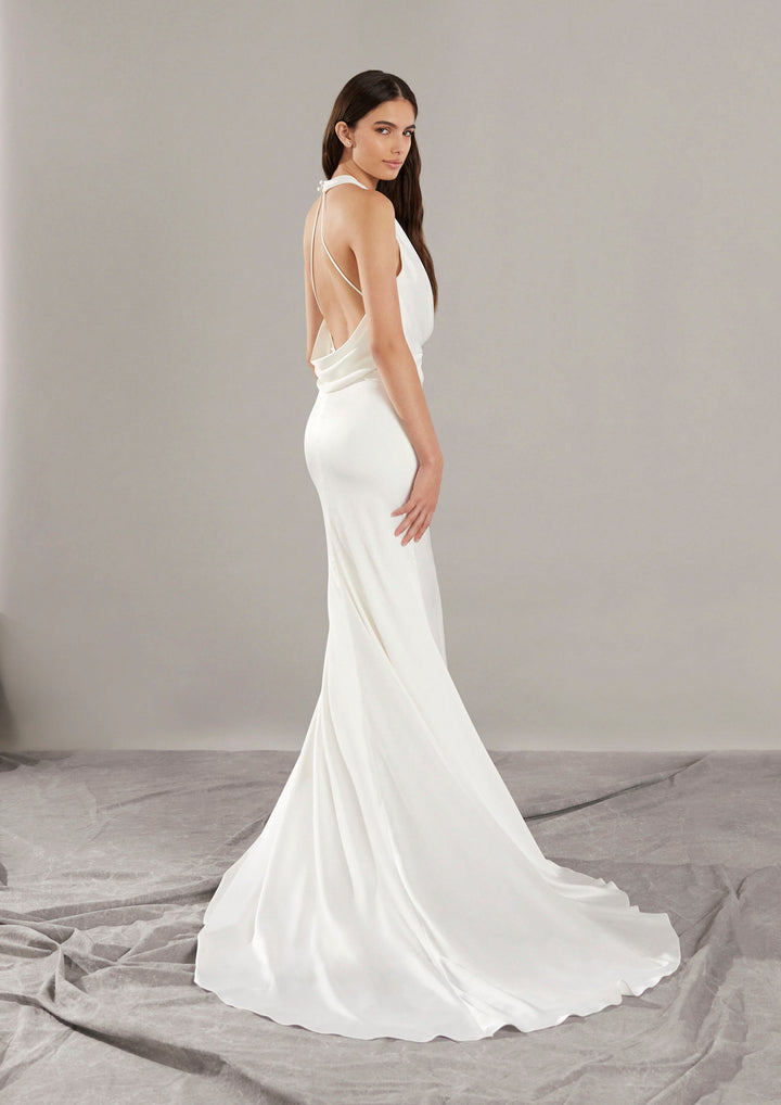 Pronovias Gabriell fitted satin wedding dress with halter neckline and low back side view