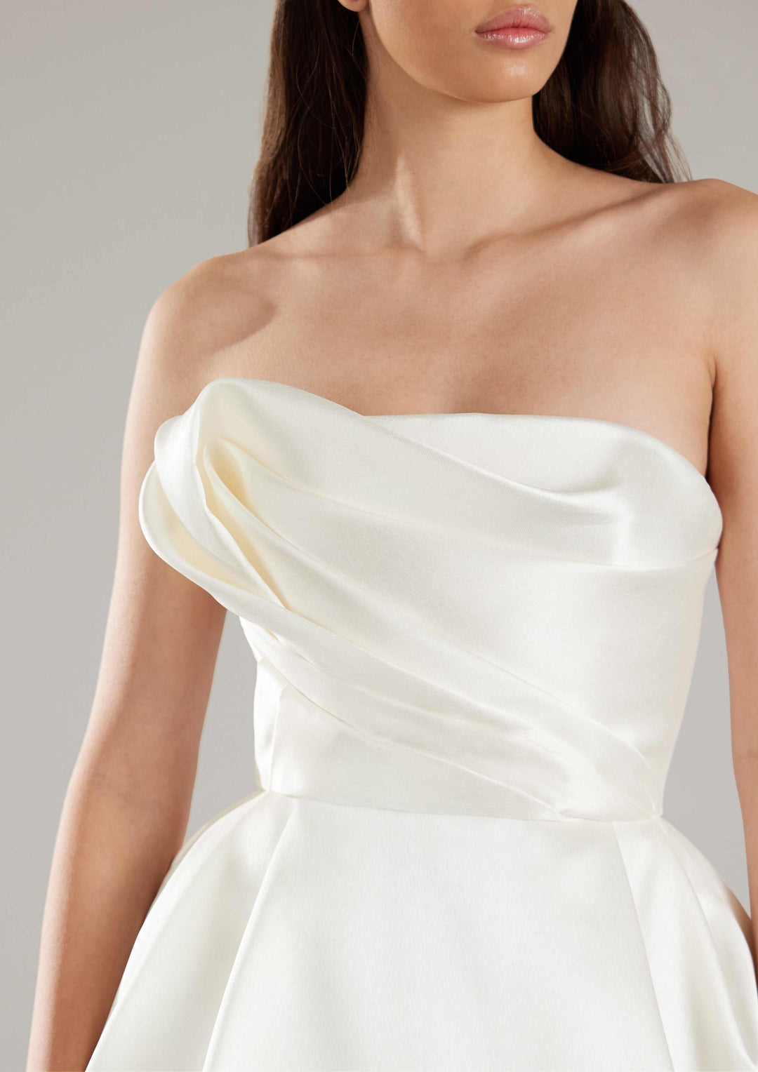 Pronovias Khloe a-line wedding dress strapless with asymmetrical neckline and micro fabric front details view