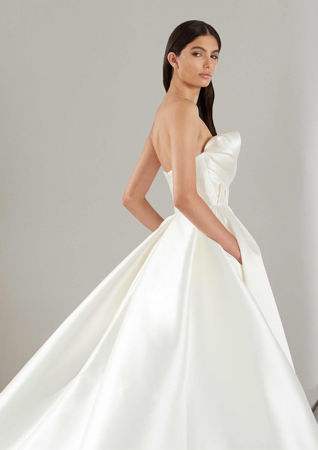 Pronovias Khloe a-line wedding dress strapless with asymmetrical neckline and micro fabric side details view