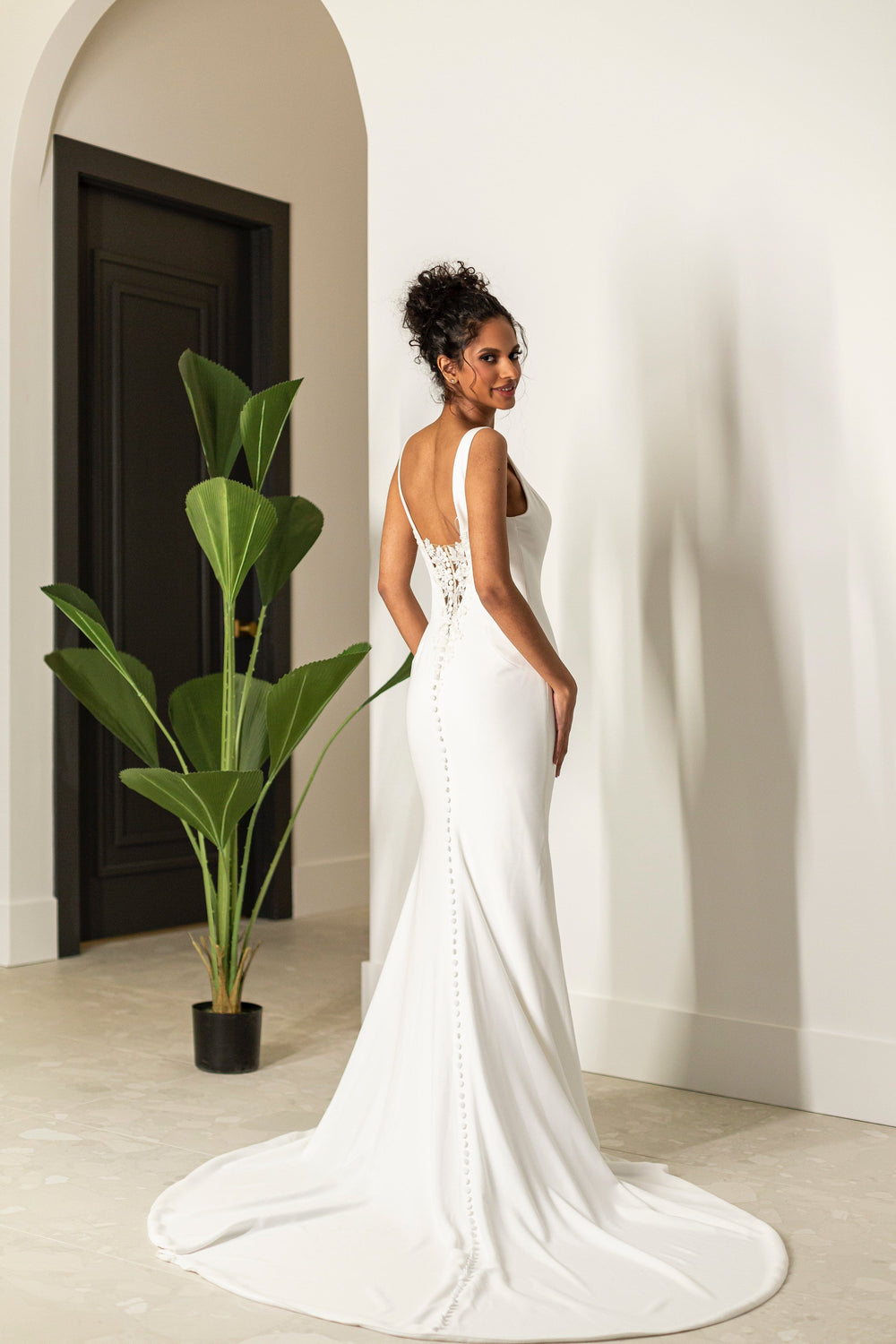 Magnolia Tulip sample sale fitted wedding dress with v-neck and low back train view